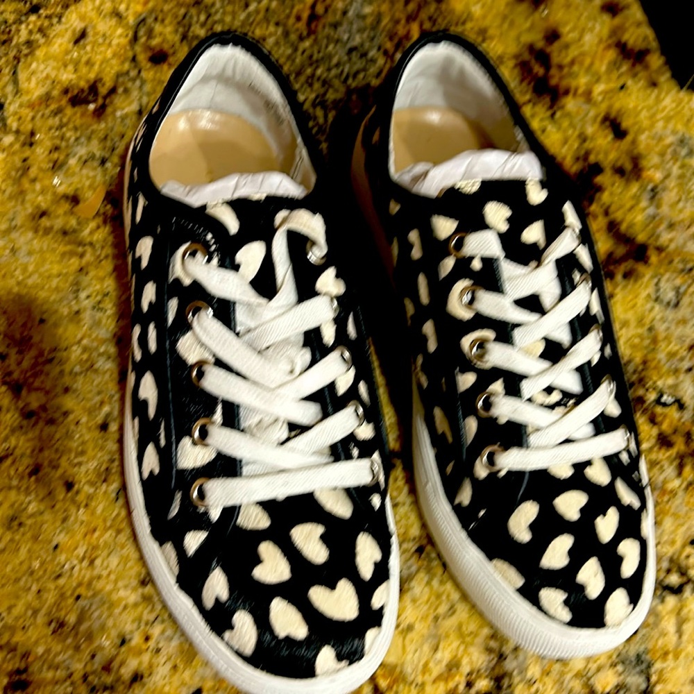 Black and white hair on calf heart tennis shoes 
Ann Taylor new , size 6